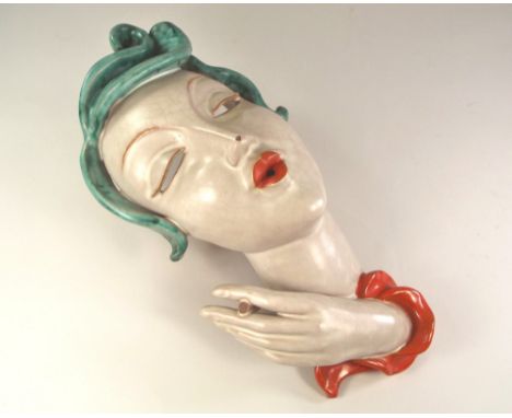 GOLDSCHEIDER. A Goldscheider, Austria, glazed terracotta wall mask, No.10(?)85. Impressed number, printed marks & original pa