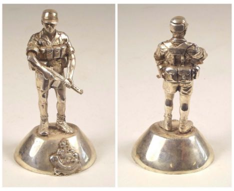 RHODESIAN LIGHT INFANTRY FIGURE.A cast silver coloured metal model of a Rhodesian Light Infantry soldier. Height 10cm. Damage