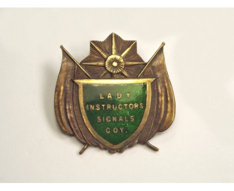WWI LADY INSTRUCTORS BADGE. A scarce WWI brass & enamel 'Lady Instructors Signals Company' badge.