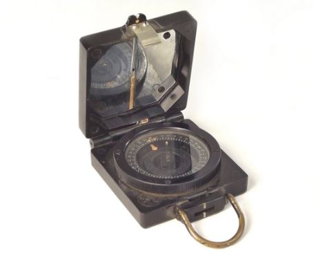 MARCHING COMPASS. A T.G. Co. Ltd. Bakelite cased Mark I military magnetic marching compass. Marked 'B65711 REF. 6E/374.