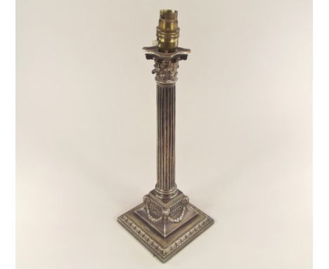 TABLE LAMP. A Victorian silver plated, classical column lamp base. Full height 39cm.