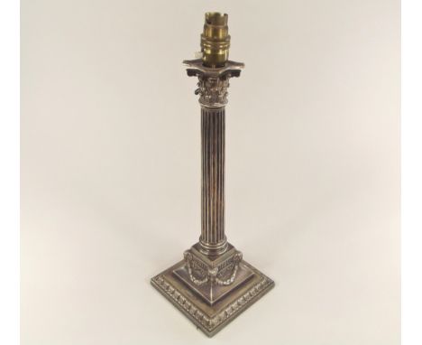 TABLE LAMP. A Victorian silver plated, classical column lamp base. Full height 39cm.