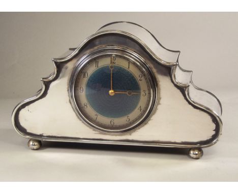 MANTEL CLOCK. A silver plated mantle clock, the Welbeck by Alex. Clark Ltd. The French movement with blue enamelled dial. Wid