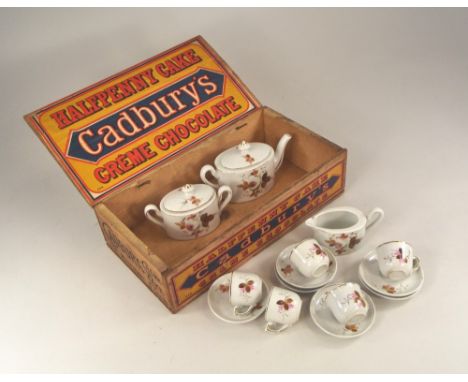 ADVERTISING BOX ETC.A Cadbury's printed & paper labelled cake box containing a child's toy tea service. 