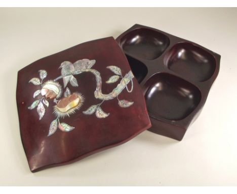 LACQUERED BOX.A Japanese lacquered box with mother of pearl inlay, the interior with four compartments. 21 x 21cm.