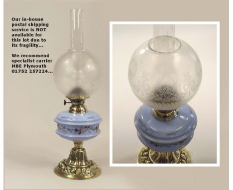 OIL LAMP. A 19th century oil lamp with painted blue glass fount. Height 49cm.