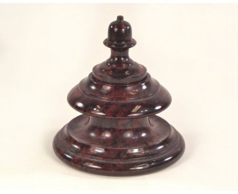 SERPENTINE. A red Cornish serpentine turned inkwell & lid. Diam. 12cm. Height 13cm.
