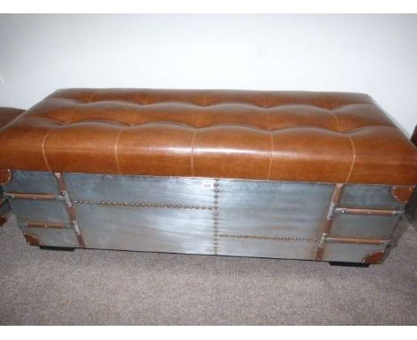 Large tan buttoned top aluminium trunk