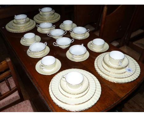 Minton fifty three piece yellow and gilt tea and dinner service