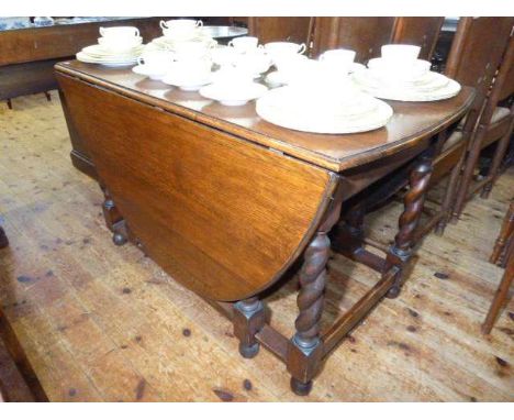 Large oak gate leg dining table on barley twist legs