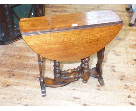 Oak drop leaf coffee table on bobbin turned legs