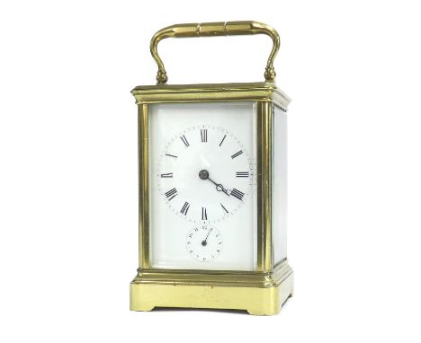 Good carriage clock timepiece with alarm and striking on a bell, within a corniche brass case, 7.5" high