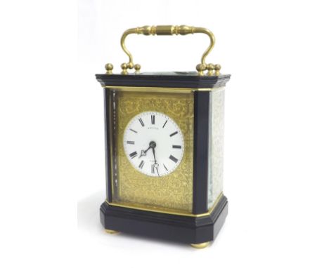 French ebonised and gilt metal carriage type clock striking on a small bell, the movement with outside countwheel and balance