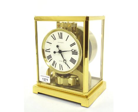 Jaeger LeCoultre Atmos clock, no. 248706, the 4.25" white dial within a polished brass glazed case, 9" high, with original bo