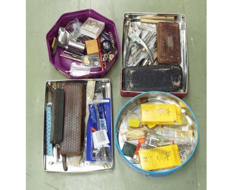 Four tins of assorted watchmakers accessories including various tools, drills etc (four tins)
