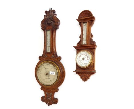 Two carved oak aneroid barometer/thermometers, the largest signed Moore & Co. to the silvered dial (2)