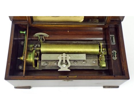 Rosewood inlaid music box, the 9.5" cylinder playing on eight airs and with original tune sheet, within a rectangular case, 1