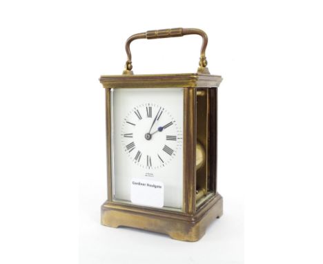 Carriage clock striking on a gong, the dial signed Gibson, Belfast, within a brass corniche gilded case, 7.25" high; also wit