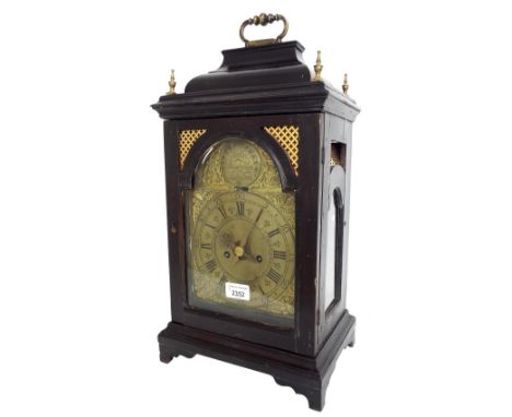 Ebonised two train bracket clock with small verge movement striking on a bell, the 7" brass arched dial signed John Bushman, 