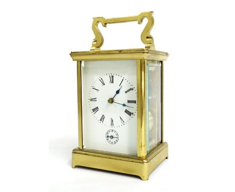 French carriage clock with alarm and striking on a gong, within a corniche brass case, 7.5" high