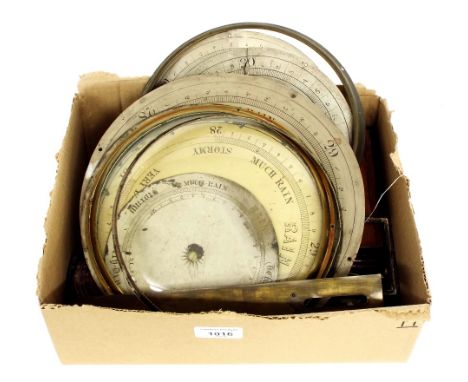 Box of various barometer parts, including dials and glasses etc