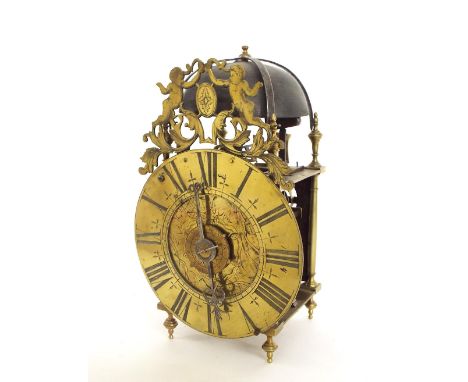 Interesting brass verge lantern clock, the 7.5" dial enclosing an engraved centre with central alarm dial and single iron han