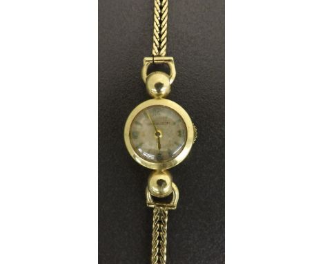 Jaeger LeCoultre 9ct lady's bracelet watch, case ref. 2782, the small silvered dial with Arabic quarter numerals and baton ma