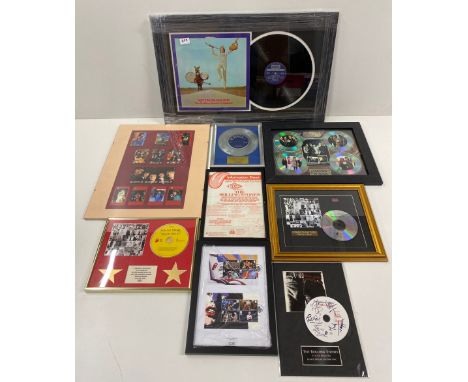 A collection of framed Rolling stones picture discs and others, largest 71 x 45cm.
