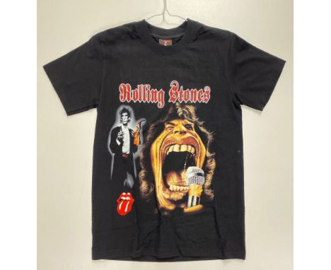 Four medium men's Rolling Stones commemorative t-shirts with varying designs.