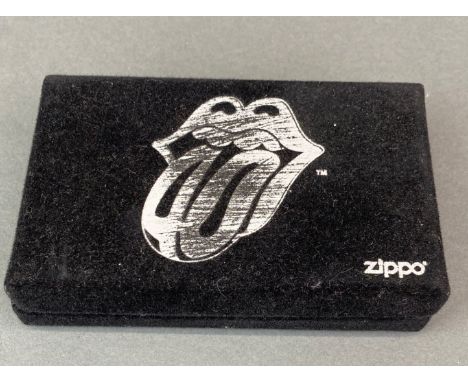 A 2002 40 licks limited edition Zippo lighter, no. 7286/10000, in presentation box and unused.