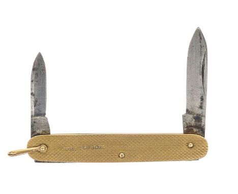 A 9ct mounted folding pocket knife fob. With engine turned decoration, London 1948, length 7cm.