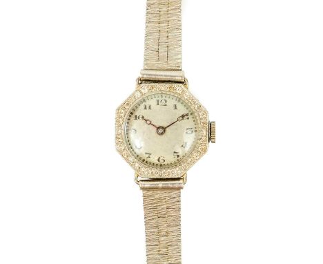 An Art Deco 18ct &amp; platinum diamond set lady's cocktail wristwatch, with 9ct bracelet. The 18mm silvered dial with black 