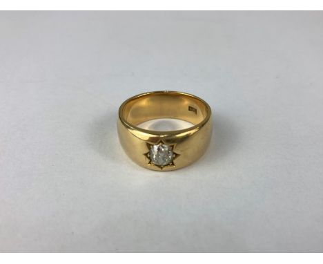 A gentleman's diamond ring the oval old cut stone gypsy set in 18ct gold