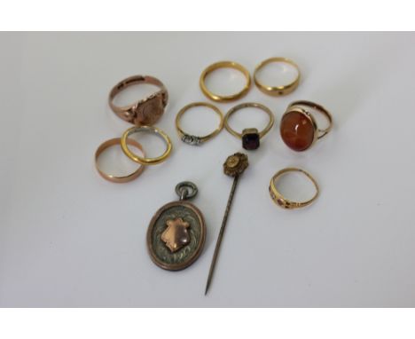 Eight various gold rings 9, 18 and 22 carats, 28.7g gross, a stick pin and medal