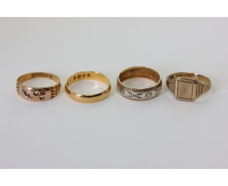 A 22ct gold wedding ring; two 9ct gold rings; a 15ct gold and gem set ring (a/f) 11.7g