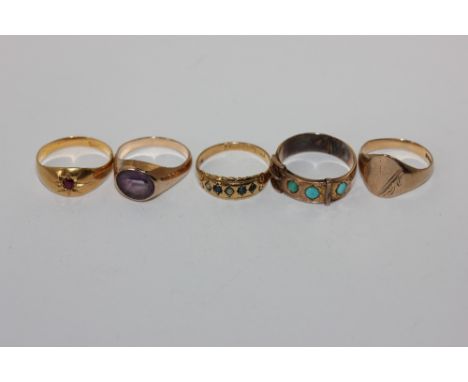 A ruby ring; and four other rings