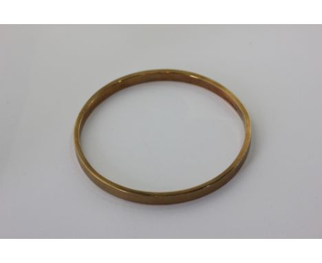 A 9ct gold engine turned amulet 22.3g