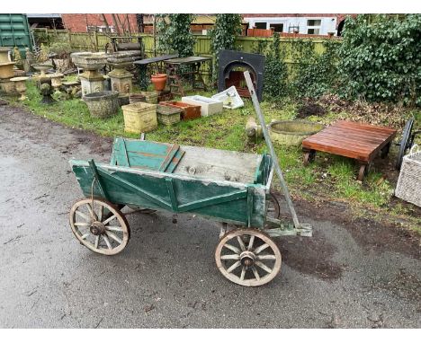 A vintage green painted wooden dog cart, length 154cm.
