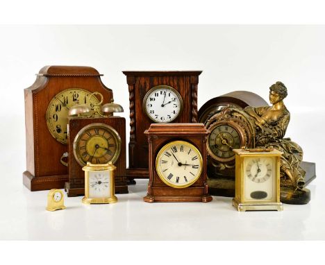 A collection of early 20th century and later clocks including an inlaid mahogany example, the silvered dial signed 'Gilbert',