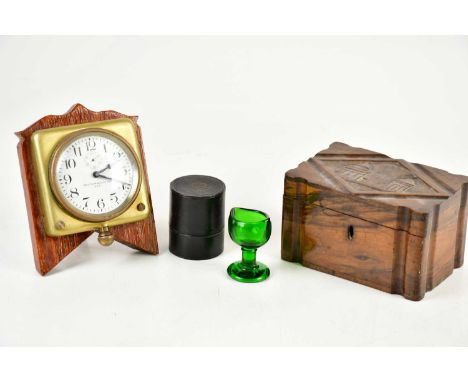 WALTHAM WATCH CO USA; a car clock on an oak mount, a carved walnut box and a green glass eye bath (3). 