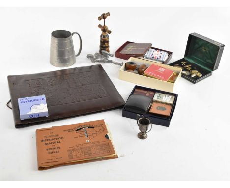 An assortment of collectors' items including Ronson lighters, Parker-Hale instruction manual, various pipes, military badges,