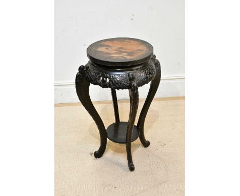 An early 20th century Chinese ebonised jardinière stand, with undertier shelf, height 74cm. 