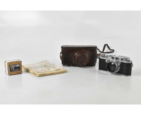 LEICA; a Leica IIIc 35mm rangefinder camera, serial No 411180, with a Summitar 5cm f2 lens, serial No 611677, with Leica bran