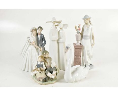 LLADRÓ; a large figure, 'Lady Grand Casino', height 33cm, two further Lladrό figures, a model of a swan and a Nao figure grou
