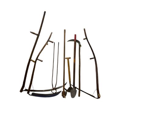 A collection of vintage farm/gardening tools including three scythes, half moon, etc (8).