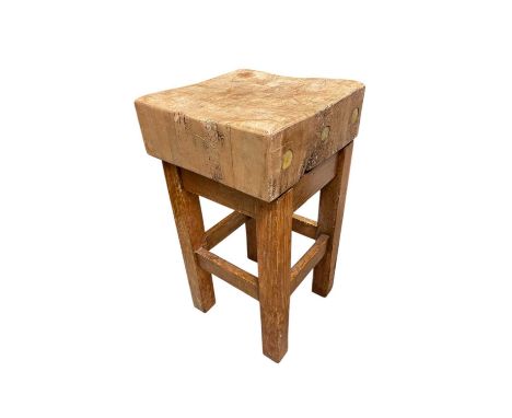 A vintage butcher's block on stand, height 82cm, width 45cm.
