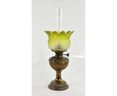 A 1920s oak barley twist table lamp, height 45cm, and a standard lamp, and a brass oil lamp with green glass shade, height 15