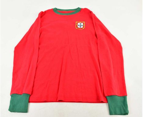 EUSÉBIO; a signed retro style Portugal football shirt, signed verso, size S.Condition Report: Light creasing and fading, no c