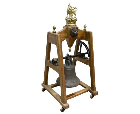 A large gun metal ship's bell, mounted on a contemporary decorative stand, with applied bronze lion mask heads and gilt metal