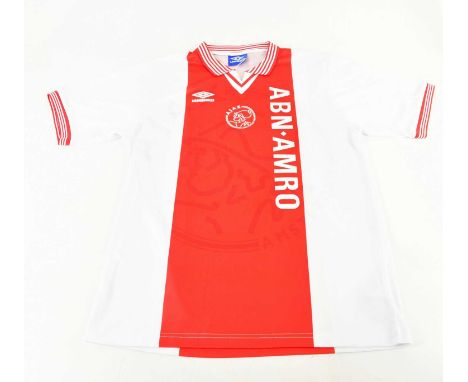 DENNIS BERGKAMP; a retro style Ajax signed football shirt, signed verso, size L.Condition Report: Light creasing and fading, 